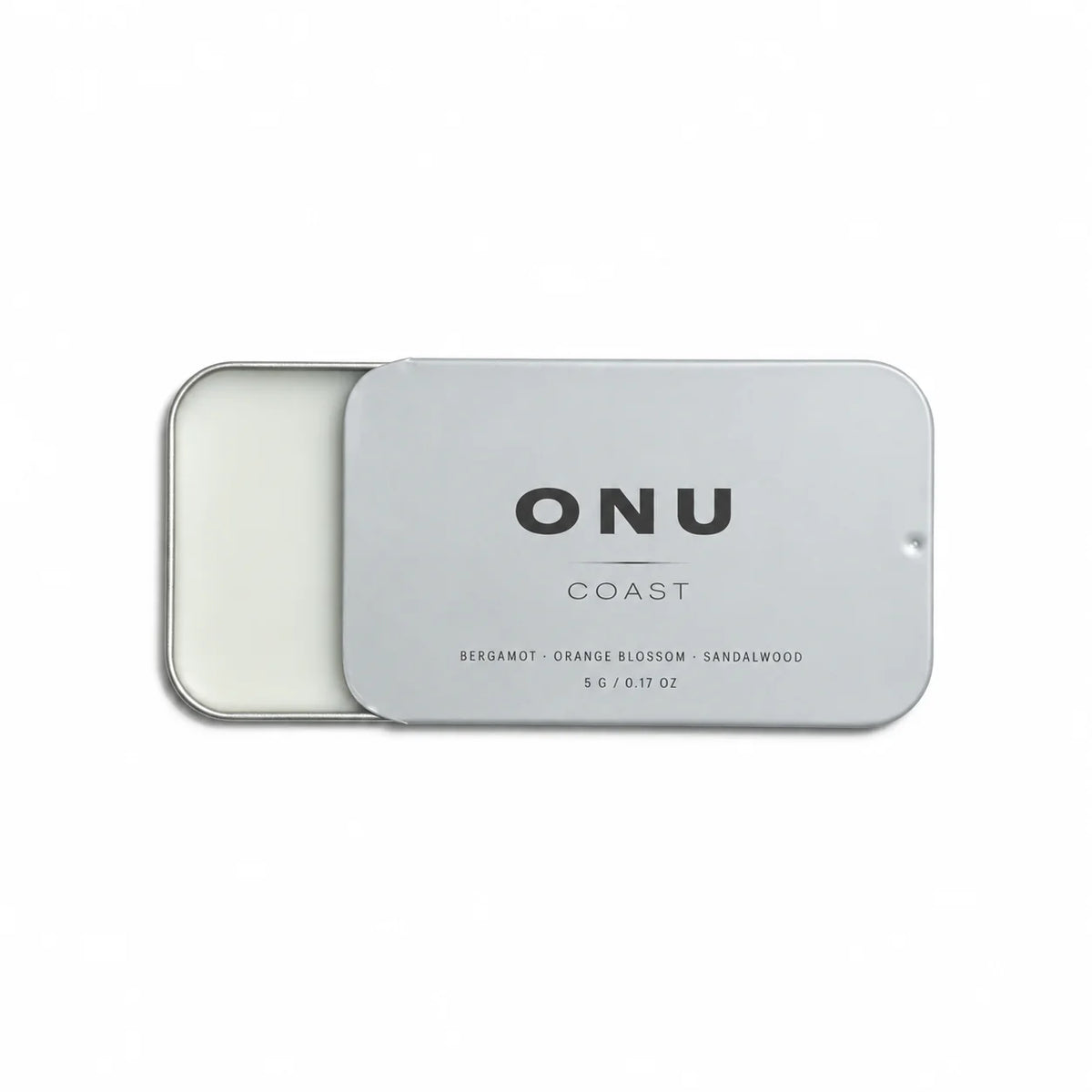 Open silver ONU COAST solid balm cologne card showing the white balm on a clean white background.