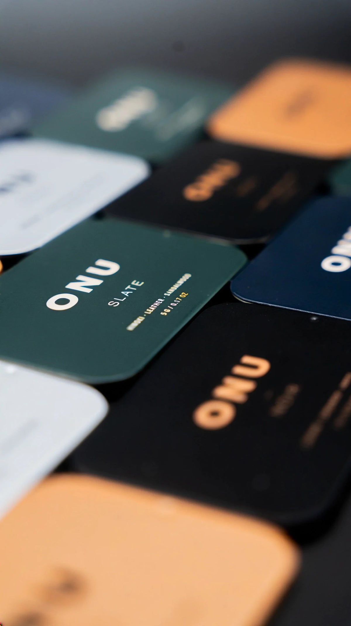 Green ONU SLATE card among the five ONU solid cologne scents