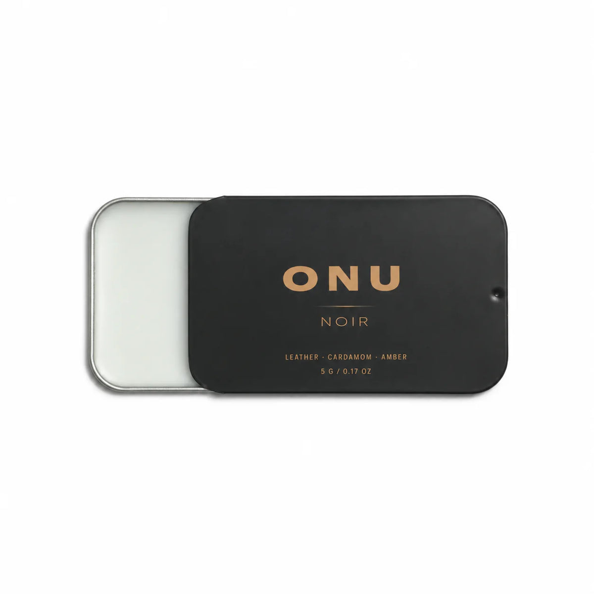 Open black ONU NOIR solid balm cologne card showing the white balm on a clean white background.